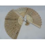 A late 19th century bone and painted gauze panel fan, floral and bird decorated with lace detail,