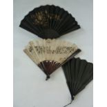 A tortoiseshell and lace fan, boxed 35.5cm, a black wooden fan, a black fan with black silk and gilt