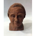 Terracotta head sculpture of an older woman, 27cm high