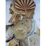A quantity of Oriental circular fan/ hand screens, some gauze and hand painted, a horn hand