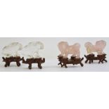 Pair of Chinese rose quartz models of lion dogs, 5cm long and a pair of quartz models of hares,