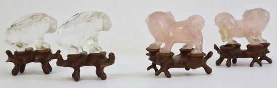 Pair of Chinese rose quartz models of lion dogs, 5cm long and a pair of quartz models of hares,