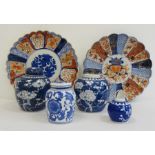 Two Japanese Imari circular dishes and four blue and white Oriental ginger jars (one missing lid and