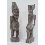 African carved Grebo figure with one eye, 32cm high and another carved African figure with two
