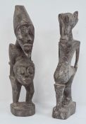 African carved Grebo figure with one eye, 32cm high and another carved African figure with two