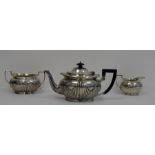 Mappin & Webb Victorian three-piece silver tea service, allover shaped semi-gadrooning, teapot