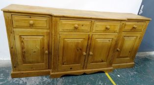 20th century pine breakfront sideboard with four drawers and four cupboard doors, plinth base, 202 x