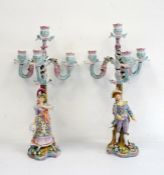 Pair of 19th century porcelain candelabra, four-branch, floral encrusted with male and female