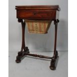 Victorian rosewood games work table, the rectangular top above plain edge, opening to reveal