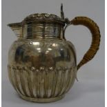 Victorian silver lidded jug with egg and dart decoration to lid, floral engraving decoration and