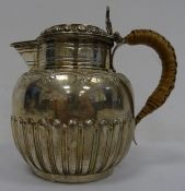 Victorian silver lidded jug with egg and dart decoration to lid, floral engraving decoration and