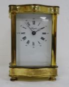 Mid 20th century carriage clock in brass case, the white face with Roman numerals marked 'Angelus'