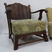 Early 20th century oak framed armchair with panelled back overstuffed seat