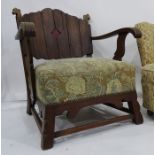 Early 20th century oak framed armchair with panelled back overstuffed seat