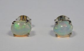 Pair of silver and white Ethiopian oval cabochon opal stud earrings