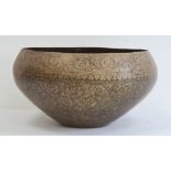 Large Middle Eastern/Indian niello brass bowl, the exterior decorated with bands of scrolling