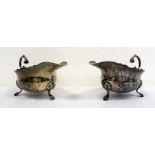 Pair of 1920's silver sauceboats of plain form with scalloped feet, London 1929, maker's mark