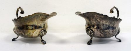 Pair of 1920's silver sauceboats of plain form with scalloped feet, London 1929, maker's mark