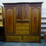 19th century wardrobe compactum with dentil cornice above two short bowed doors, above two short and