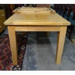 Modern oak rectangular extending dining table on square section supports with two extra