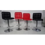Four modern leather upholstered bar stools, two in black, two in red (4) and a Samsonite suit
