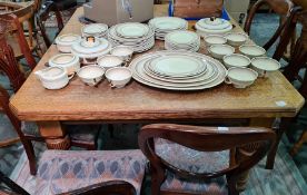 19th century oak extending dining table, the rectangular top with canted corners on turned