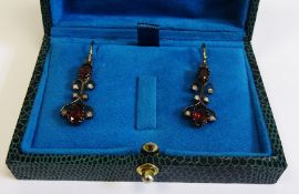 Ornate garnet and diamond drop earrings, boxed