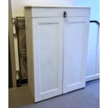 White painted two door wardrobe, the hinged mechanised doors opening to reveal integral hanging