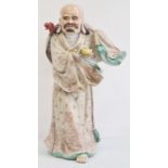 20th century Chinese porcelain figure of a man, impressed six-character mark to base, modelled