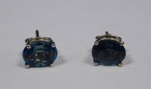 Pair of silver and blue topaz stud earrings