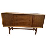 Gordon Russell Afromosia teak sideboard, three central drawers, flanked by cupboard doorsCondition