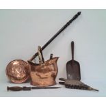 Copper warming pan, a copper coal scuttles, bellows and other fire tools