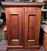 20th century two door cabinet with moulded cornice, panelled doors emblazoned H De Cabanas Y