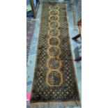 Mustard ground runner with nine elephant foot guls, in yellows and blacks, 75cm x 250cm approx