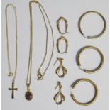 9ct gold crucifix on 9ct gold chain, a pair of 9ct gold hoop earrings, another gold hoop earring and