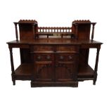 Oak aesthetic period sideboard with mirrored back, two central drawers and cupboard doors above