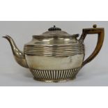 Early 20th century silver teapot with wooden handle, gadrooned and reeded decoration, Sheffield