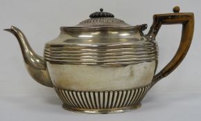 Early 20th century silver teapot with wooden handle, gadrooned and reeded decoration, Sheffield