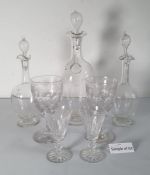 A set of six Waterford cut glass wines, three various decanters, and various other cut glass wines