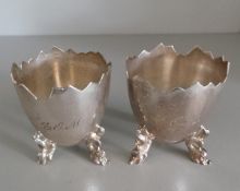 Pair of possibly Scandinavian silver-coloured (marked 830s) egg cups, with cracked eggshell design,