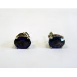 Pair of silver and amethyst oval stud earrings