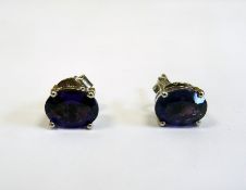 Pair of silver and amethyst oval stud earrings