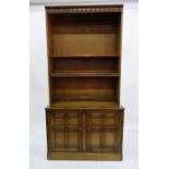 Ercol mid elm 20th century shelving unit with adjustable shelves above a base of two panelled