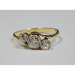 18ct gold and diamond three-stone ring, the central circular bezel-set diamond 0.4ct approx, flanked