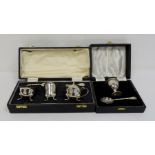 1930's silver cased three-piece cruet set with two spoons, Sheffield 1939, makers E&H, 4.7oz and a