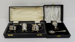 1930's silver cased three-piece cruet set with two spoons, Sheffield 1939, makers E&H, 4.7oz and a