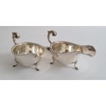 Pair of Edward VIII silver sauce boats on splayed feet, with egg and dart decoration to rim,