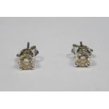 Pair of 18ct white gold and diamond earrings each brilliant cut claw set, approx. 0.4ct each