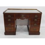 Late 19th century mahogany desk with three-quarter gallery to top, moulded front edge above nine