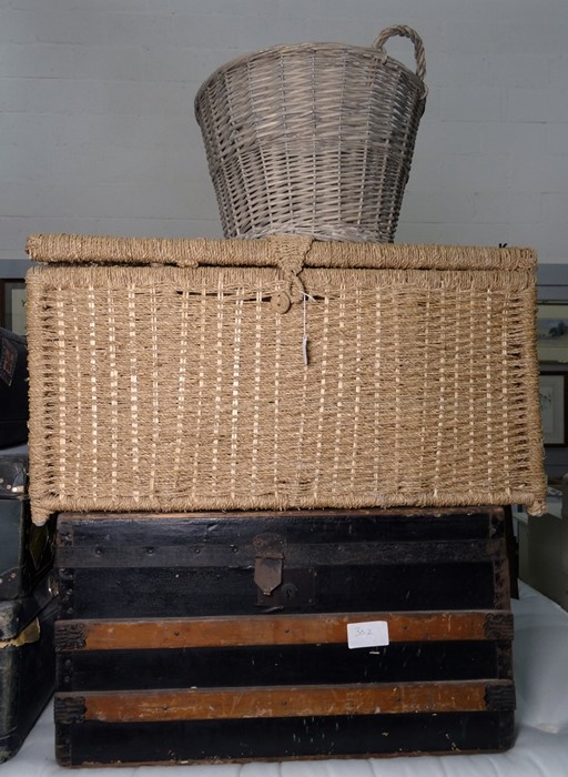 Metal and wood banded travelling trunk, a large wicker laundry basket and another basket (3)